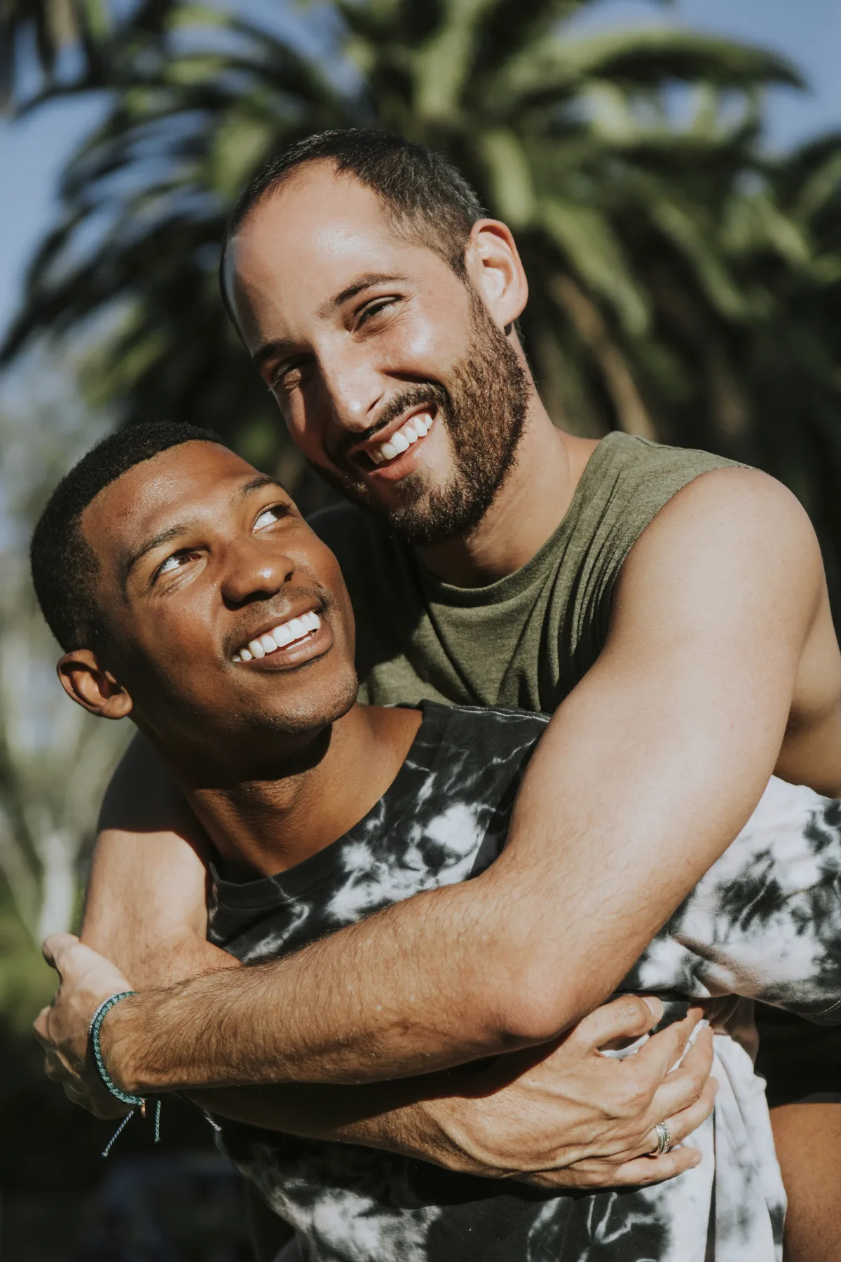 Two men holding hands